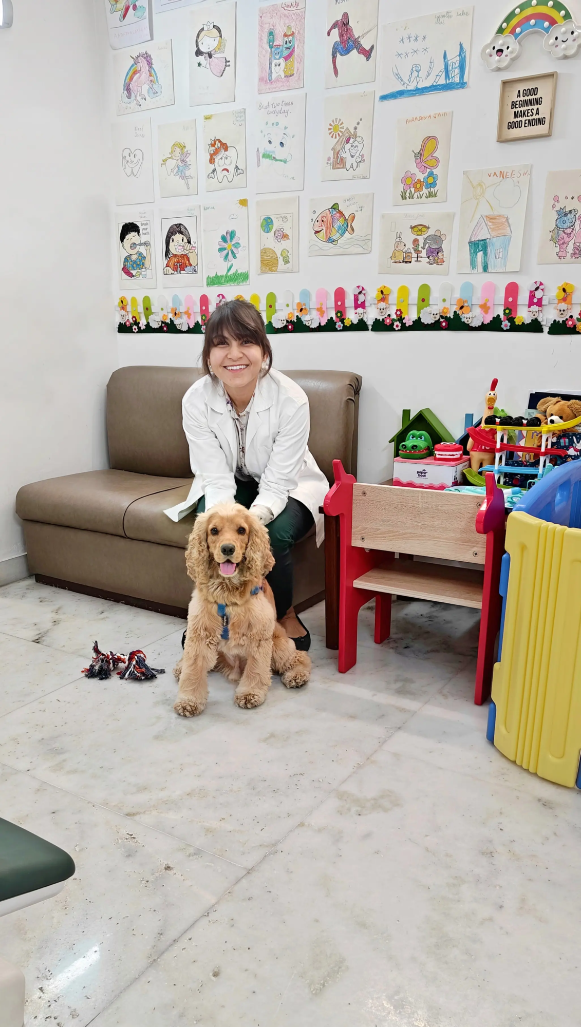 Wrigley, India’s first certified dental therapy dog, comforting a child patient at HNM Dental Centre in Vasant Vihar, New Delhi